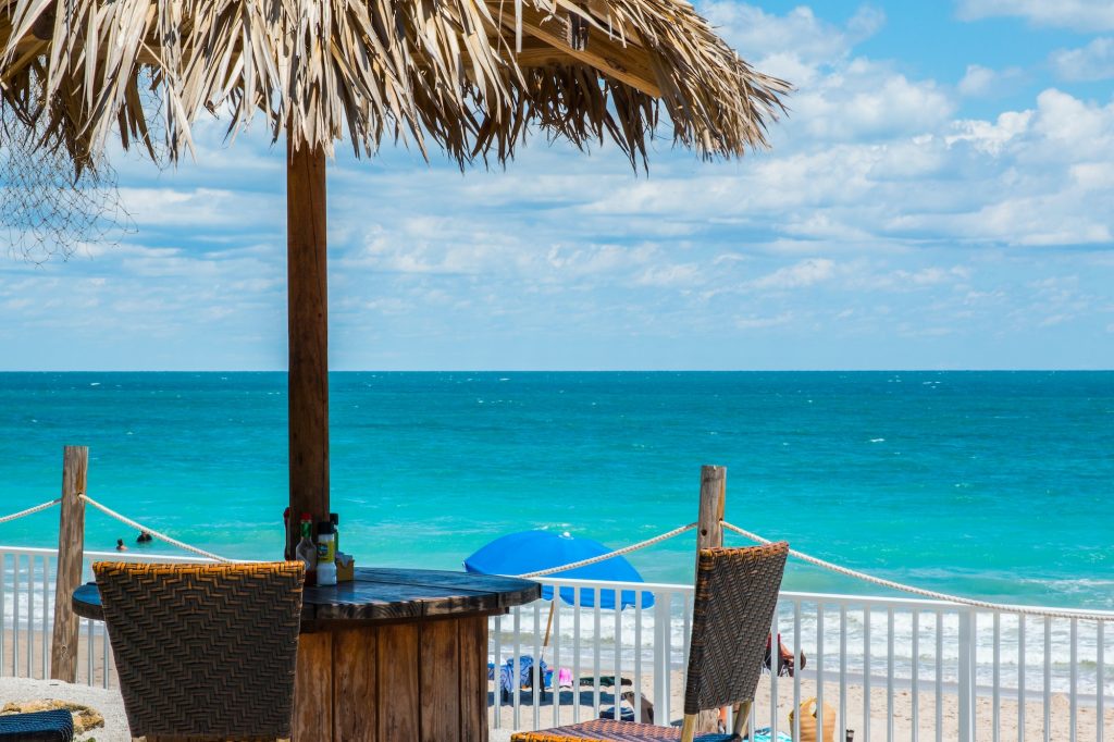 Looking out at a beautiful beach with a chickee hut